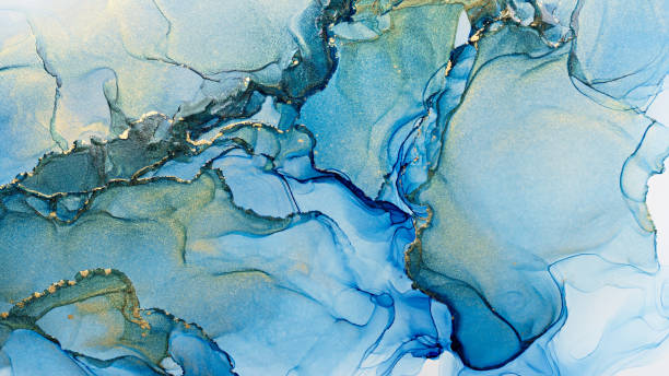 istock Blue and shiny golden alcohol ink abstract texture 1304935705