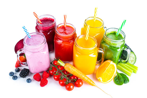 istock Healthy rainbow colored fruits and vegetables smoothies isolated on white background 1304936729