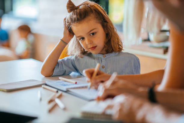 istock Mother assisting her child about homework 1304936832