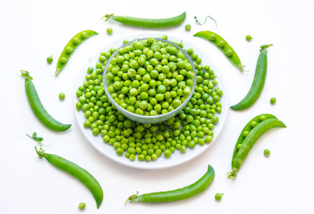 istock Close up fresh green peas in a glass bowl 1304937079
