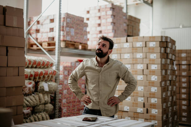 istock Quality control checker looking around in a factory 1304938232