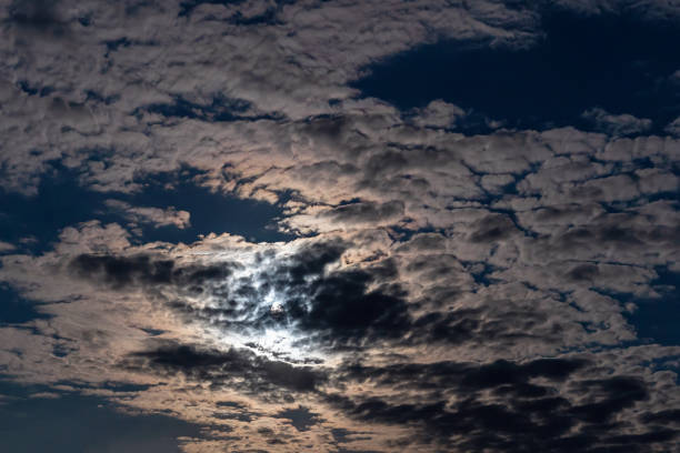 istock Full moon with clouds in the night sky 1304938955
