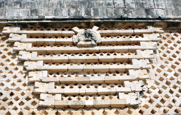 istock Ancient wall with carved ornament, Uxmal, Yucatan, Mexico 1304939243