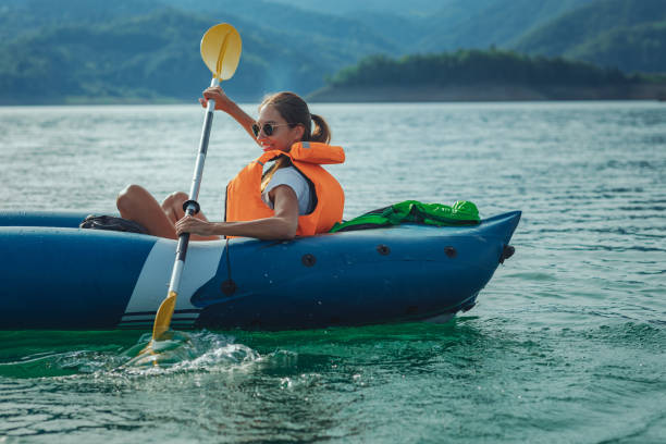 istock Female out on the water, riding kayak 1304940953