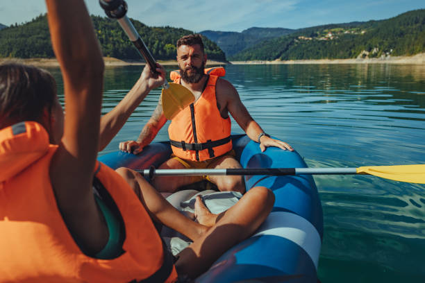istock Young people kayaking together on a lake 1304941350