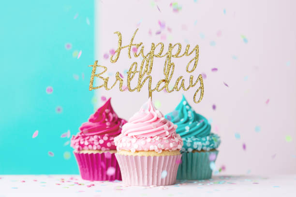 Happy birthday cupcakes in pink and blue stock photo