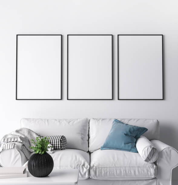 Frame mockup in modern living room design, three black frames on bright white wall