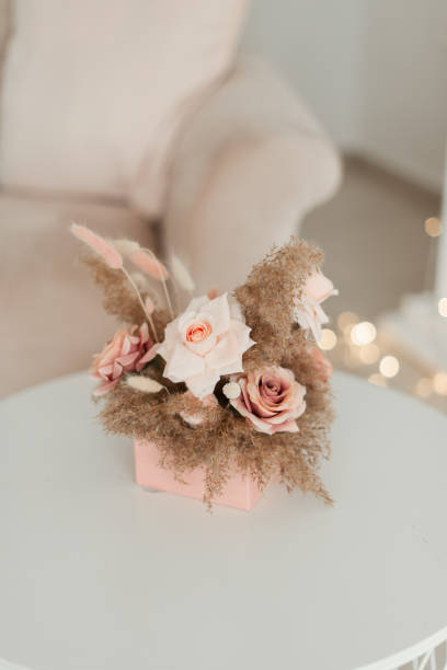 istock artificial minimalistic flowers in a pink box. interior 1304943595