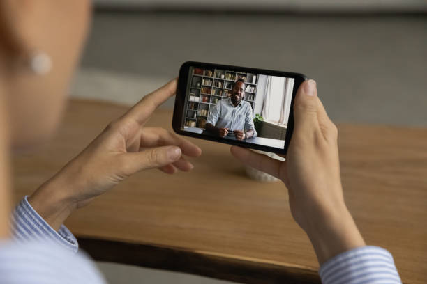 istock Multiracial colleagues have online meeting using cellphone 1304943811