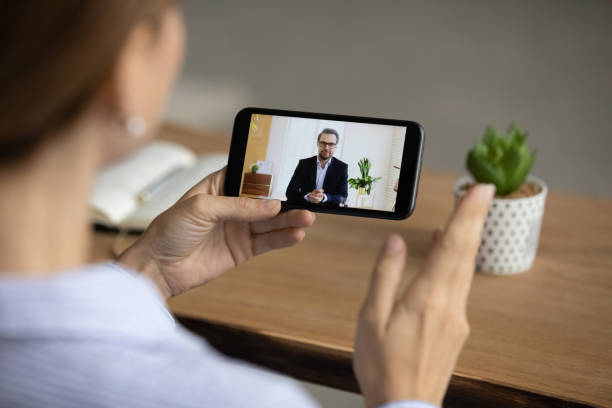 istock Businesspeople talk on video call on cellphone 1304943819