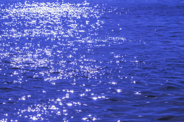 istock blue night sea with a moon lane path 1304944116
