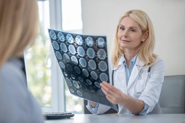 istock Doctor with MRT scan and patient communicating 1304947217
