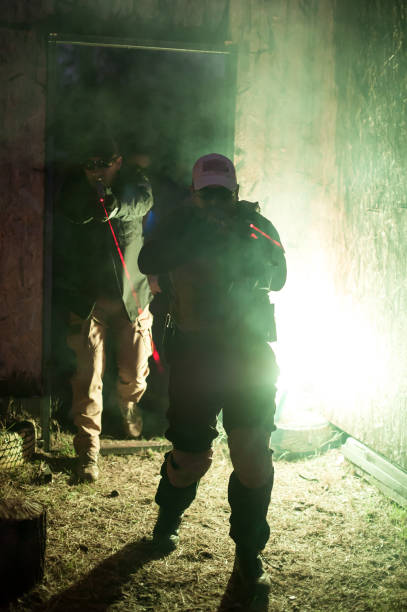 istock Army soldier in action aiming at weapon laser sight optics 1304947235