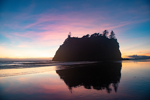 This is a silhouette of Abbey Island off the coast of Ruby Beach at sunset in Olympic National Park in Washington State in September, 2020.