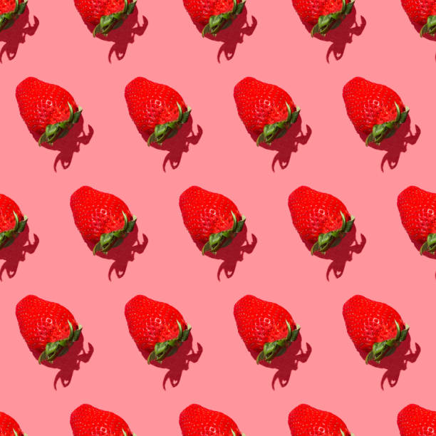 istock Seamless pattern fresh strawberry isolated on pink background top view 1304952755