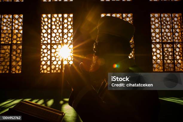 The Imam Who Reads The Quran During Ramadan Stock Photo - Download Image Now - Ramadan, Praying, Islam