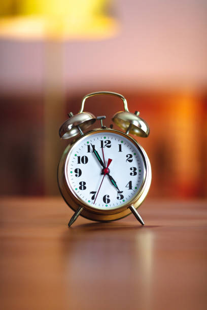 istock old gold alarm clock - 5 O'Clock 1304954412