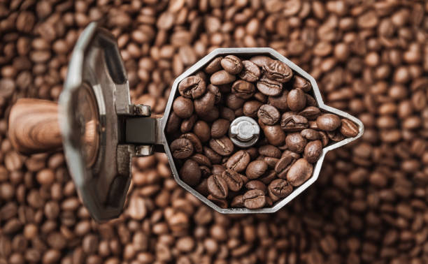 istock Top view on mocha pot full with coffee beans. 1304954522