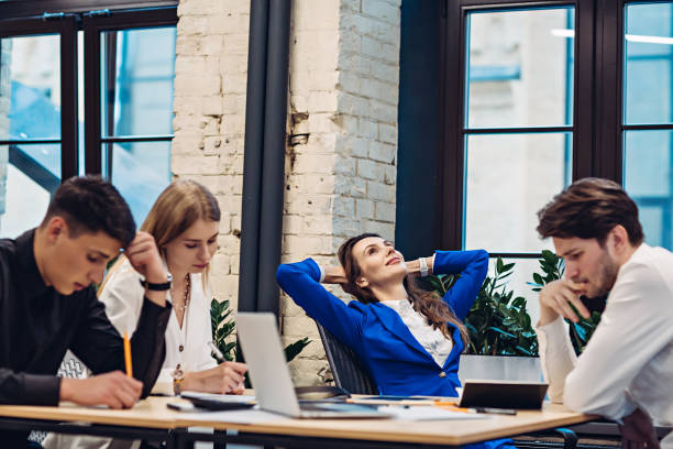 istock Businesswoman relax while her colleagues working 1304956089