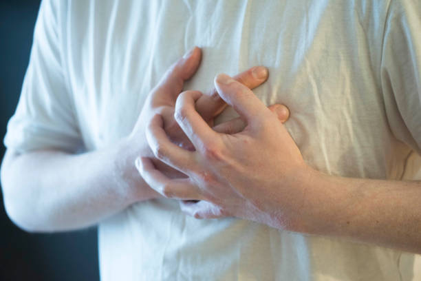 istock person having a heart attack 1304956204