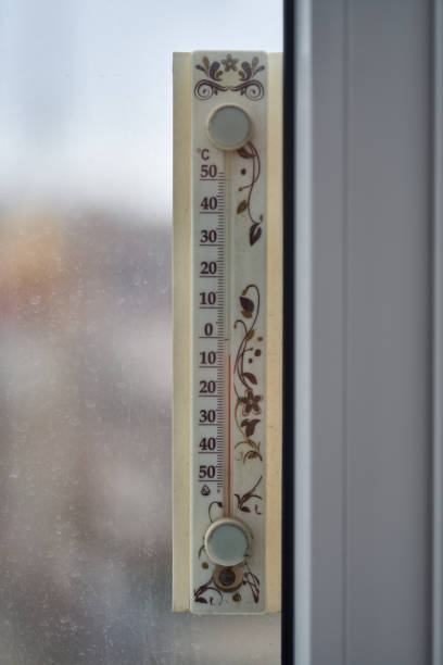 istock a thermometer for air temperature hangs on the window 1304957271