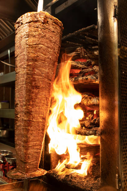 istock Shawarma is prepared on fire from firewood. 1304957351