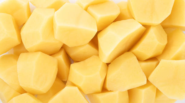 istock Full frame of peeled and chopped potatoes. 1304962174