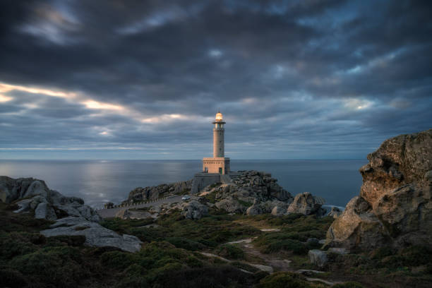 Punta Nariga Lighthouse. Galicia, Spain. Punta Nariga Lighthouse. Galicia, Spain. in Malpica, GA, Spain bedrock stock pictures, royalty-free photos & images