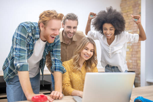 istock Young professionals working in the office together and looking happy 1304964689