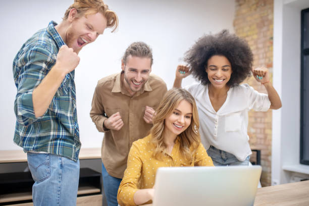 istock Young professionals working in the office together and looking happy 1304964701