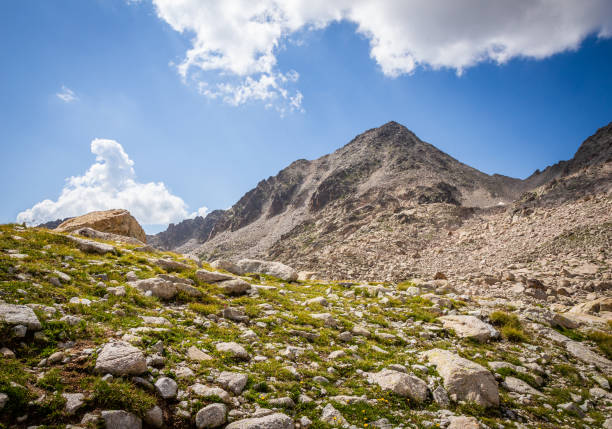 istock Nice postcard of a mountain surrounded by green meadows with rocks in summer 1304965100