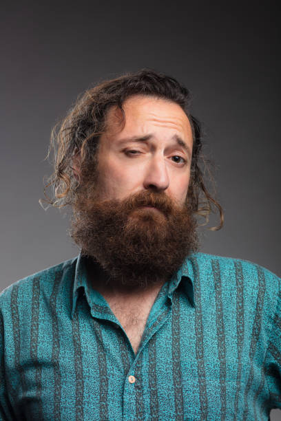 istock Studio Shot of Man with Full Beard Making a Face 1304966647