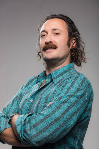 istock Studio Shoot of Uncertain Looking Man with Mustache 1304966743