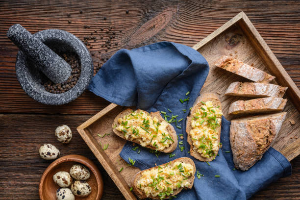 istock Healthy breakfast, scrambled quail eggs topped with chopped chives 1304968585