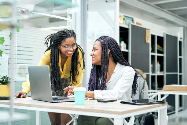 istock Businesswomen working with a laptop computer sitting in their office. 1304972319