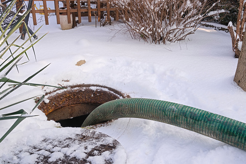 pumping septic tanks from the backyard tank in the countryside