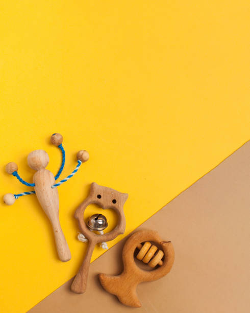 istock Children's wooden toys, rattles and teethers. Copy space. 1304974420