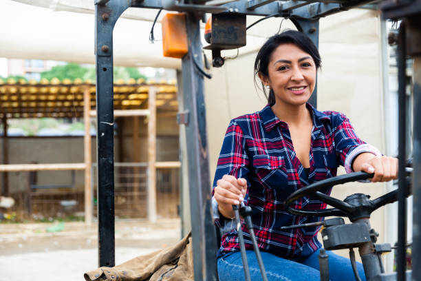 istock Worker of materials warehouse working on forklift truck 1304976290