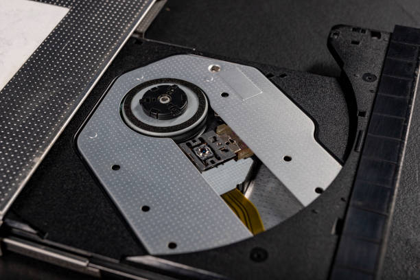 istock The inside of the CD reader. A laser mechanism for reading compact discs. Dark background. 1304977857
