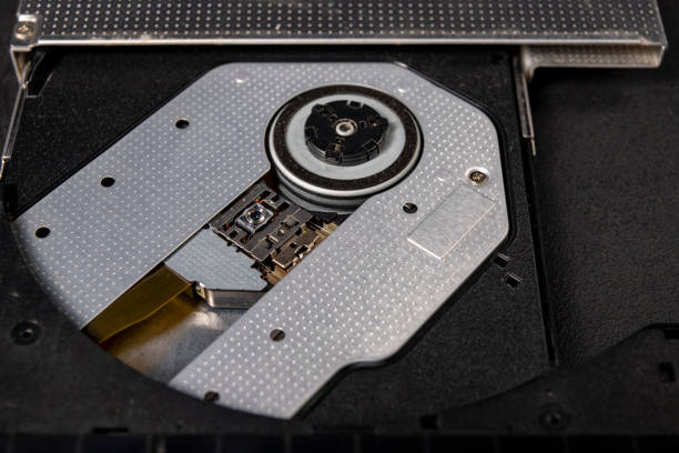 istock The inside of the CD reader. A laser mechanism for reading compact discs. Dark background. 1304978461