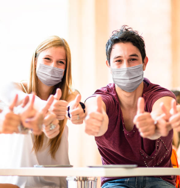 istock friends at the cafe with face mask 1304979730