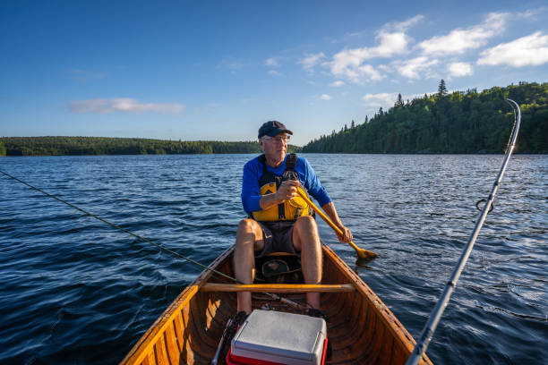 istock Senior man fishing. 1304981595