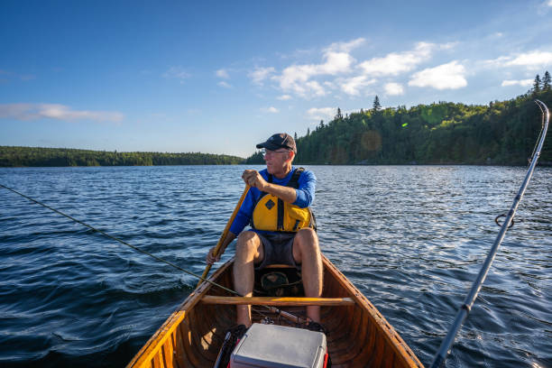 istock Senior man fishing. 1304981624