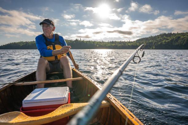 istock Senior man fishing. 1304981626