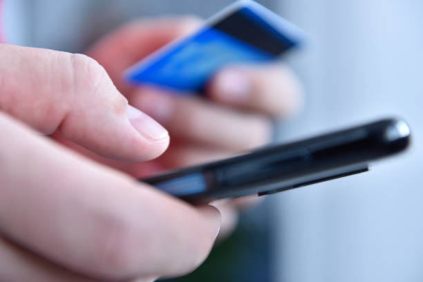 istock Businessman paying with credit card online 1304984216