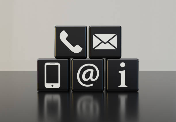 istock Black dice with contact symbols and white background 1304985281