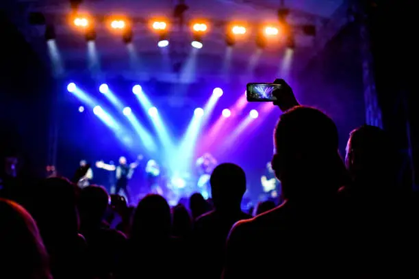 Photo of Happy people dance in open-air music festival concert stock phot