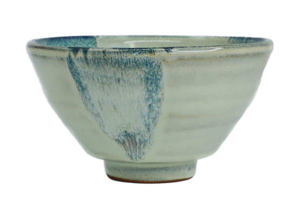 istock empty beautiful blue ceramic bowl handmade isolated on a white background, pottery with your own hands 1304991567