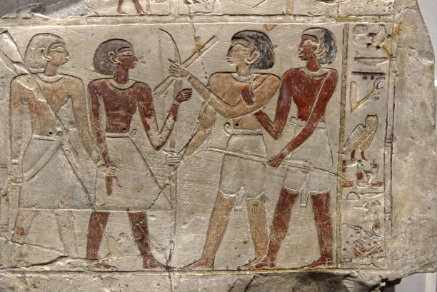 istock an Egyptian stele depicting hunters with bows 1304993282
