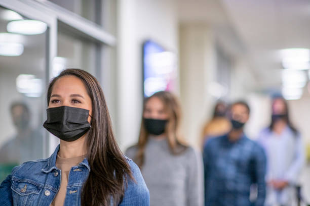 istock Normalizing Wearing A Mask on Campus Stock Photo 1304998604